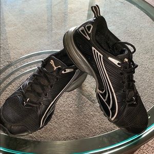 Black Puma athletic shoes